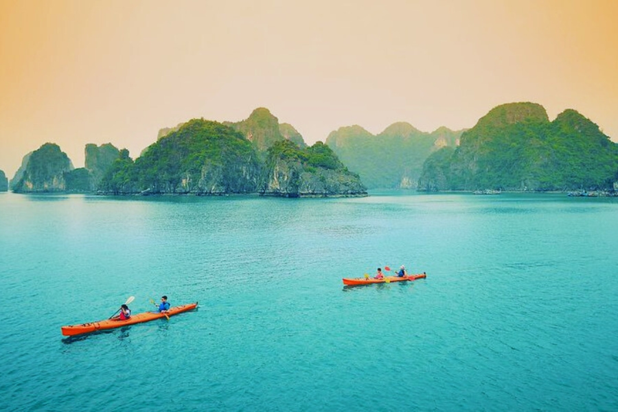 Travelers kayaking near Halong Bay Budget Cruises with Auasia Travel Vietnam